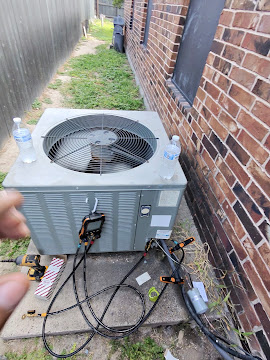 Residential condenser with gauges connected for a refrigerant charge check