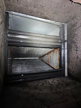 Interior of a sheet metal return air plenum after cleaning