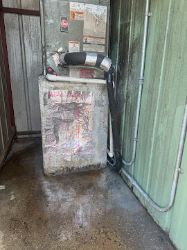 Furnace and flue connection inspected inside a utility closet