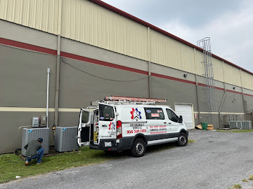 Fast Cooling AC service van parked at a commercial building during a rooftop unit service call